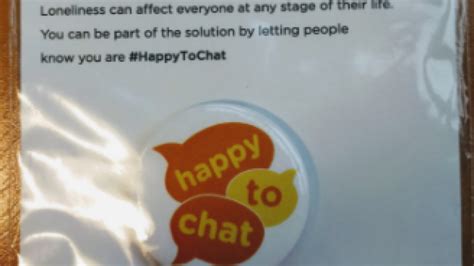 People are handing out badges at Tube stations to tackle loneliness